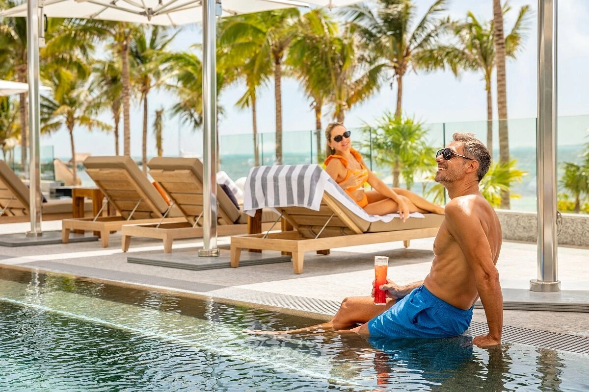 couple in the pool spending together time swimming
