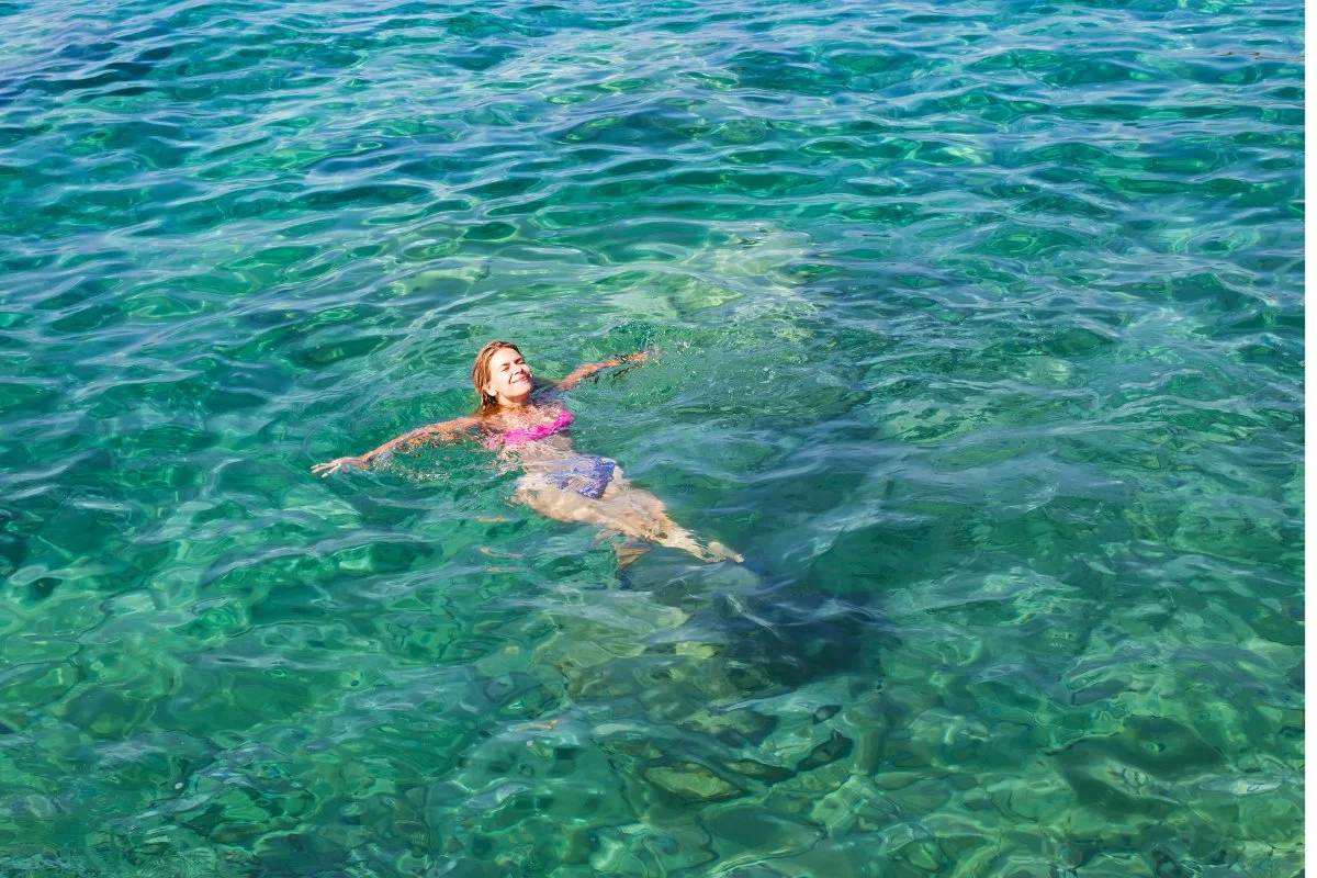 swimming in crystalline water