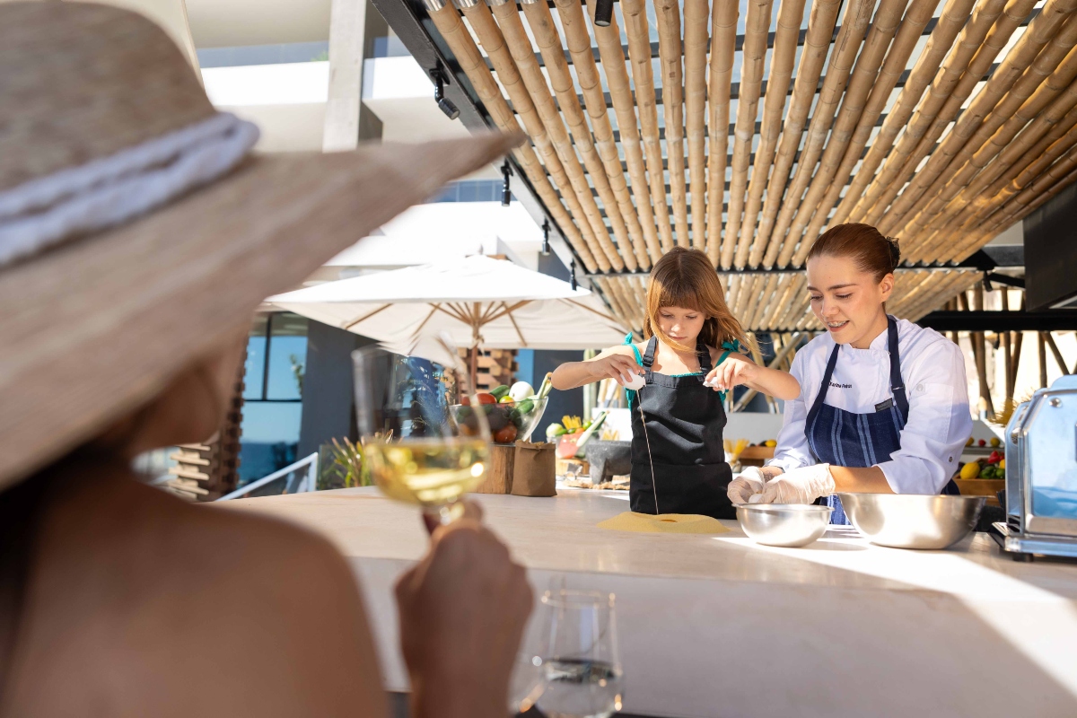 kid having cooking class at Garza Blanca Cabo