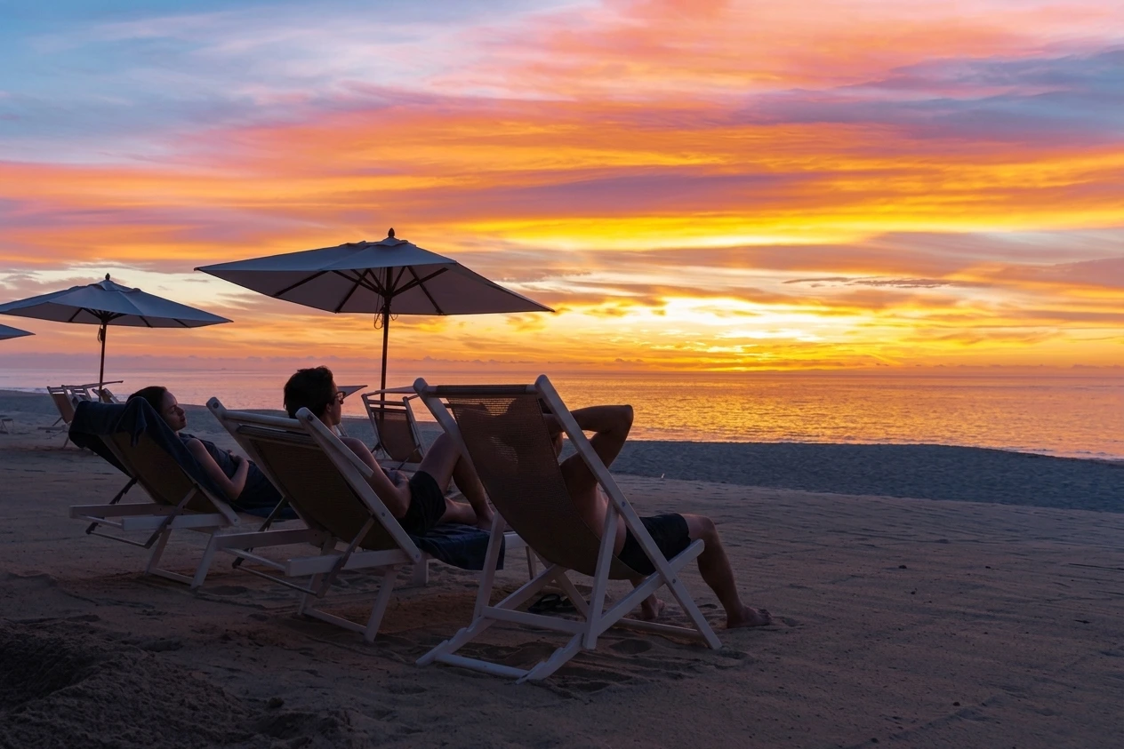 group of three friends resting in the beach chair