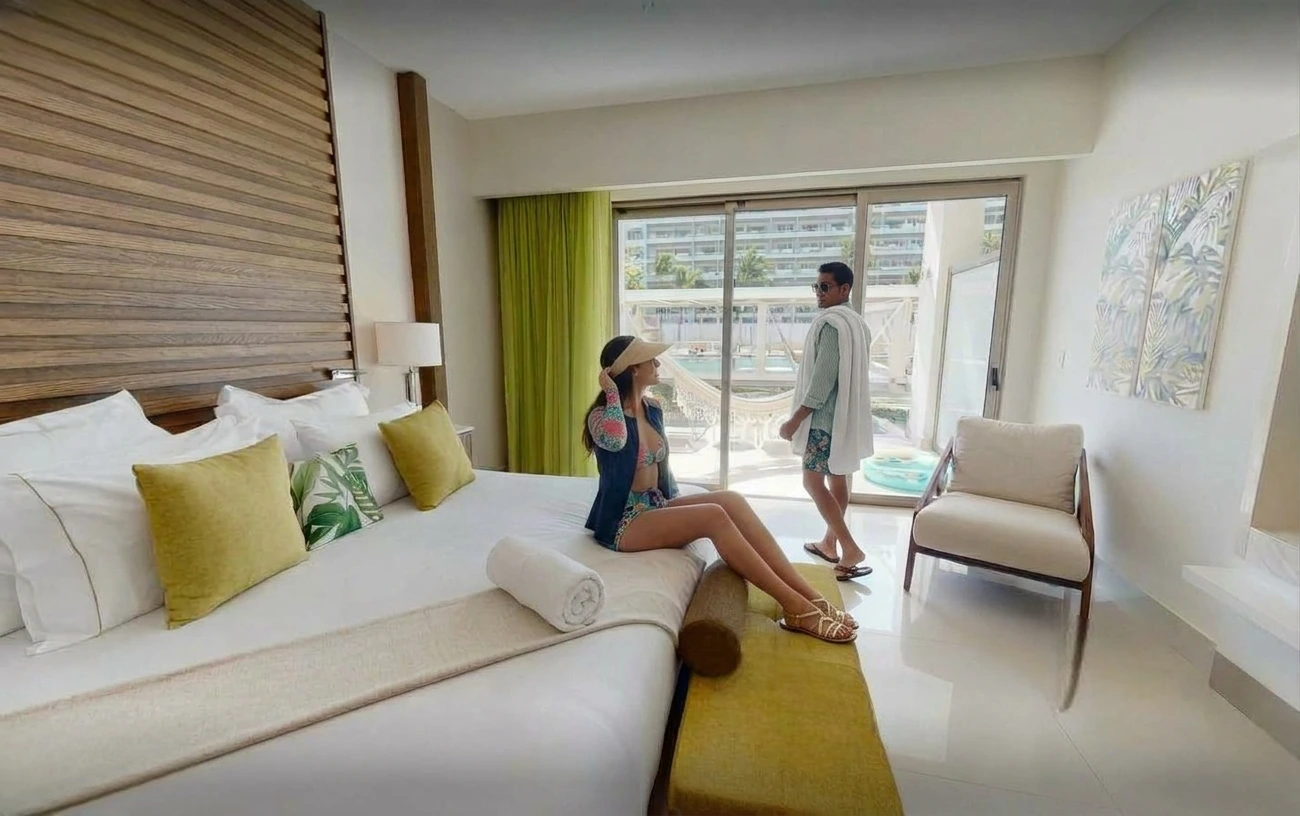 couple on a swim up suite getting ready to swim