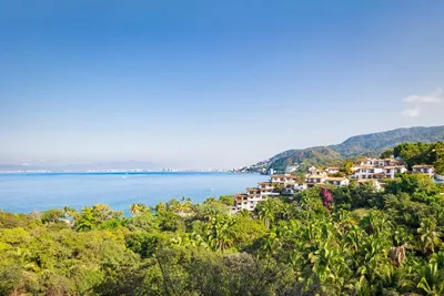 Corner Suite at Garza Blanca Sanctuary with panoramic ocean views, floor-to-ceiling windows and a spacious terrace in Puerto Vallarta.