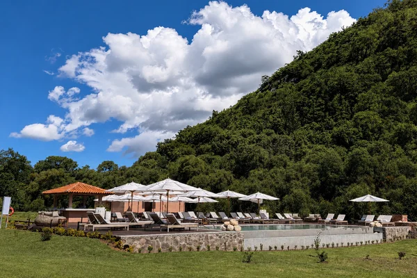 Sierra Lago Resort & Spa - Heated adults-only pool with loungers and umbrellas under a blue sky