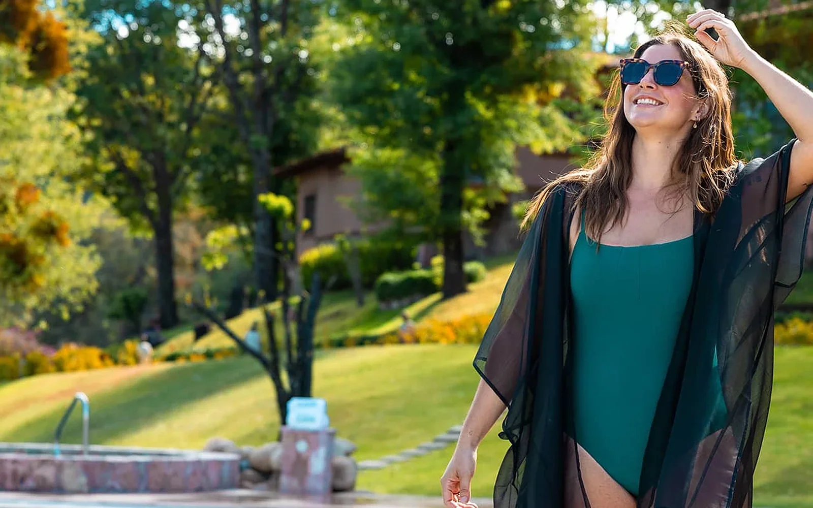 Guest walking through the gardens at Sierra Lago