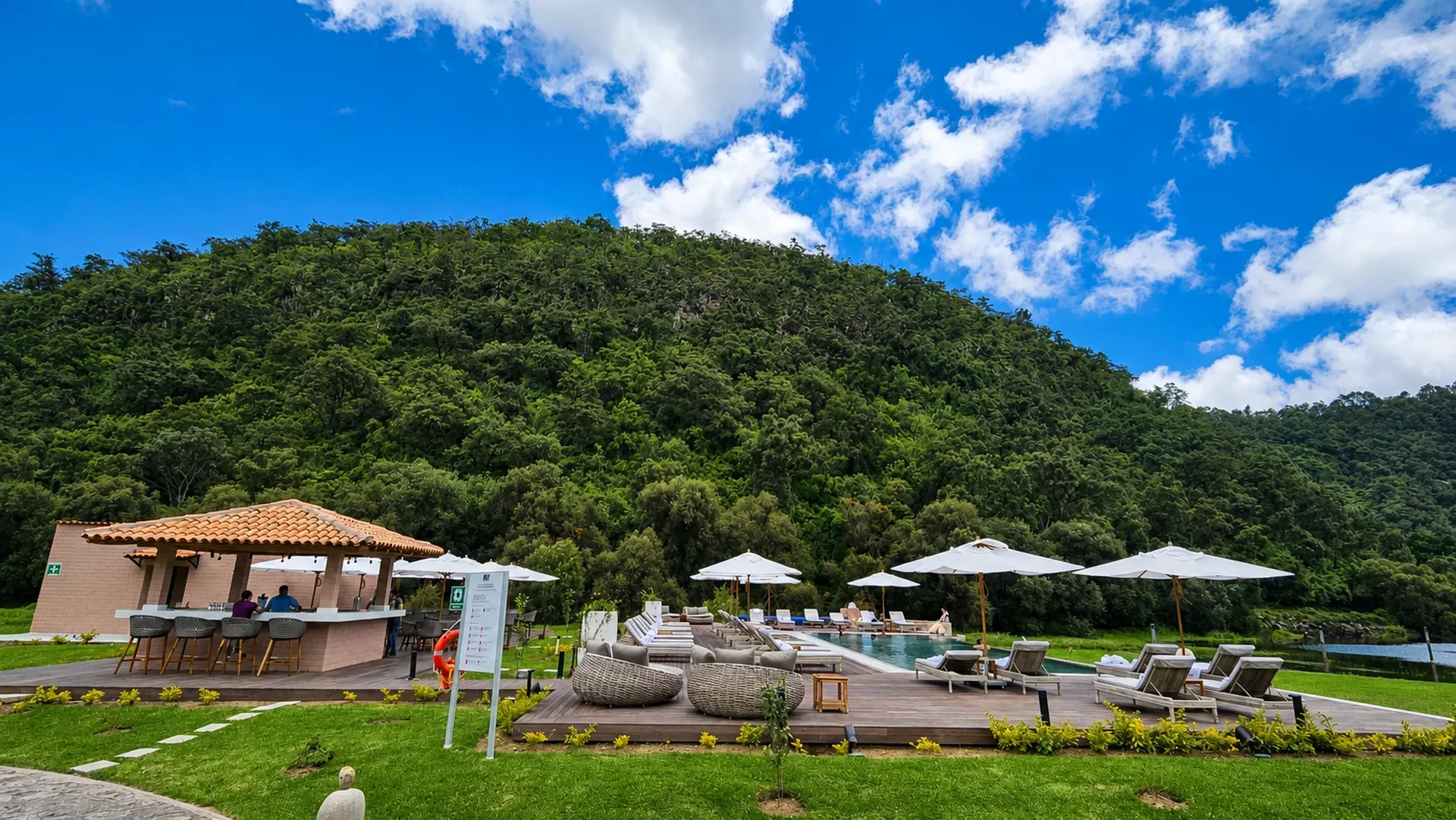 Sierra Lago Resort & Spa - Adults-only pool with umbrellas, loungers and a pool bar at the foot of the forested mountain