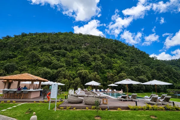 Sierra Lago Resort & Spa - Adults-only pool area with umbrellas, loungers and a bar surrounded by forest