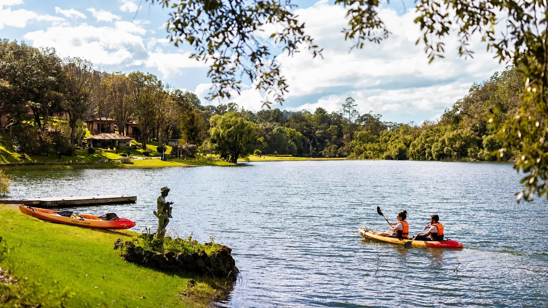 Kayaks on Juanacatlán Lake with the cabins of Sierra Lago in the background