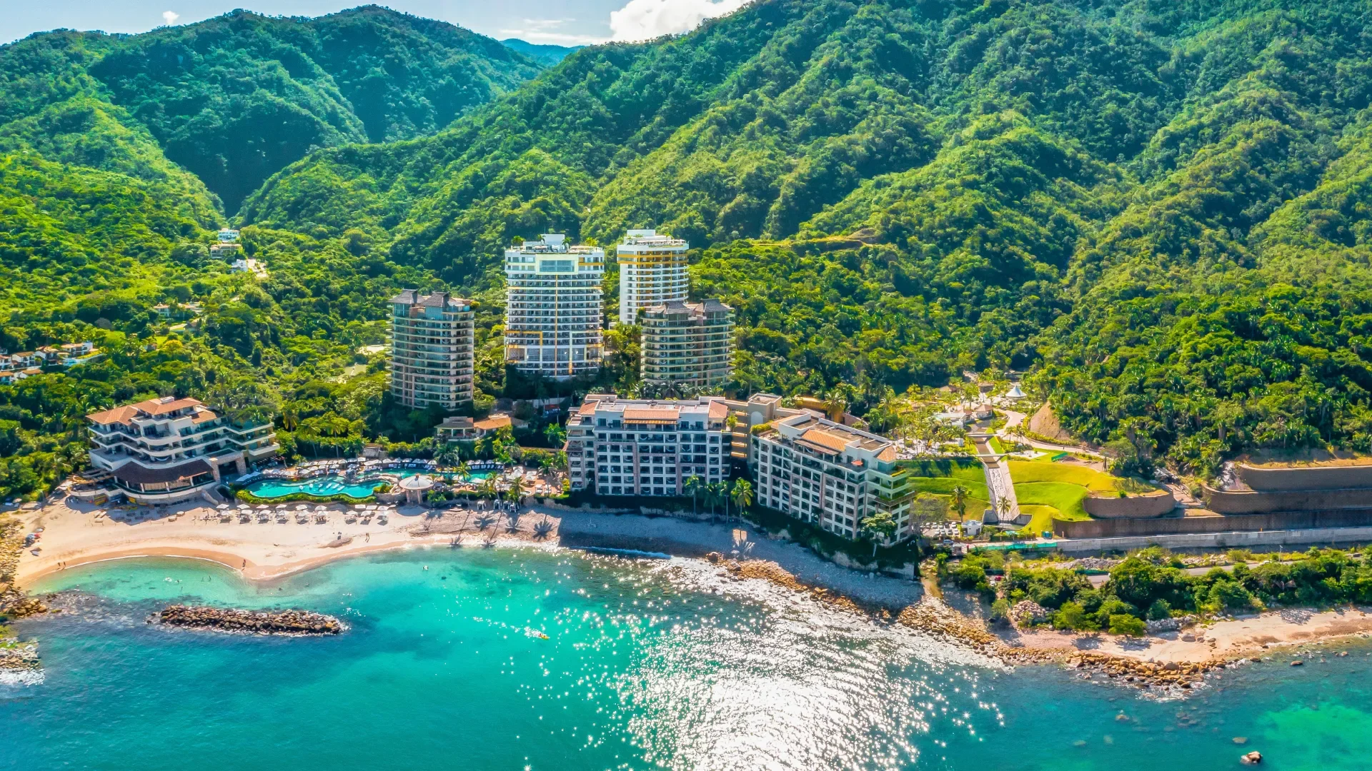 Aerial view of Garza Blanca Puerto Vallarta between the Sierra Madre jungle and Banderas Bay