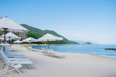 industry_niche: Luxury hospitality & tourism – high-end, all-inclusive beachfront resort in Mexico, catering to affluent travelers.
brand_product_service: Garza Blanca is a luxury, all-inclusive beach resort by Tafer Resorts. It offers sophisticated accommodations, gourmet dining across multiple specialty restaurants, wellness and spa experiences, curated family activities, adventurous excursions, and personalized service. The resort promises guests an “Escape to the Extraordinary,” combining Mexican hospitality, world-class amenities, and memorable experiences for couples, families, and groups of friends.
target_audience: Affluent families, sophisticated couples, honeymooners, and groups of friends seeking a luxury Mexican beach vacation with gourmet dining, wellness, and memorable experiences.
tone_guidelines: Inspiring, joyful, and confident; friendly yet sophisticated; balancing luxury with warmth and approachability.
writing_style: Dynamic, specific, and evocative. Use vivid descriptions that highlight unique resort experiences. Keep the style timeless and welcoming, with a touch of surprise and delight.
values_or_personality_traits: Luxury, connection, joy, authenticity, sophistication, family-friendly, adventurous, wellness-focused, contemporary, and culturally connected.
formatting: Concise paragraphs, engaging headings, and clear calls to action. Use descriptive, inspiring language without clutter.
commonly_use: “Escape to the Extraordinary,” references to Mexican culture, sensory descriptions of the Caribbean setting, specific resort features;
avoid_use: Generic travel clichés, vague adjectives (e.g., “nice,” “good”), overly formal or technical language.
never_use: Negative or fear-based messaging, comparisons to competitors, slang or unprofessional expressions.
additional_guidelines: Content should align with the five Passion Points: The Art of Living, Love Affair, Taste Buds, Blue and Beyond, Wellness. Always highlight specific resort features and experiences instead of generic descriptions. Integrate SEO keywords where natural (e.g., “best luxury resorts in México,” “family-friendly all-inclusive”). Tone may adjust slightly depending on the persona (families, couples, groups), but voice remains consistent. Emphasize the promise of “Escape to the Extraordinary” in all communications.
alt_text: Pristine white-sand beach with rows of white loungers and umbrellas, calm turquoise sea, and lush green hills in the distance.