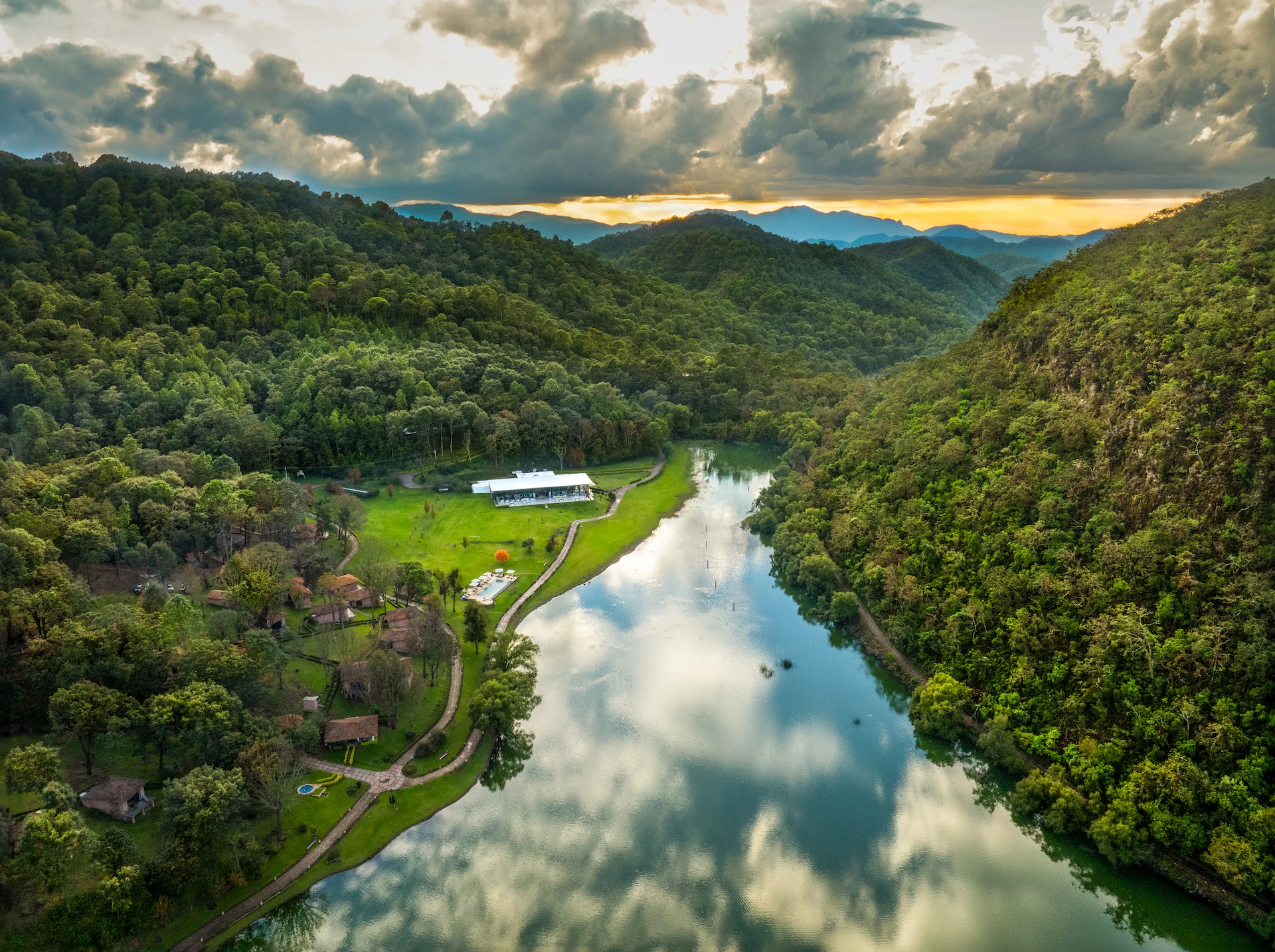 Aerial view of Sierra Lago Resort by Laguna de Juanacatlán, surrounded by forest