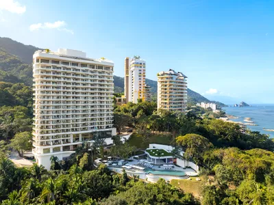 Aerial panoramic view of Garza Blanca Sanctuary oceanfront resort between the Pacific Ocean and the Sierra Madre mountains in Puerto Vallarta.