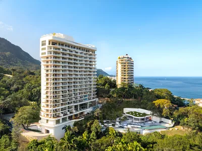 Aerial panoramic view of Garza Blanca Sanctuary oceanfront resort between the Pacific Ocean and the Sierra Madre mountains in Puerto Vallarta.