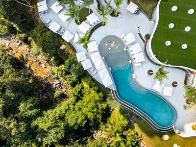 Aerial panoramic view of Garza Blanca Sanctuary oceanfront resort between the Pacific Ocean and the Sierra Madre mountains in Puerto Vallarta.