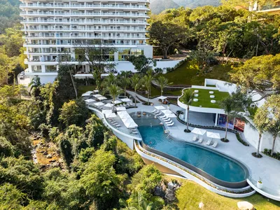 Aerial panoramic view of Garza Blanca Sanctuary oceanfront resort between the Pacific Ocean and the Sierra Madre mountains in Puerto Vallarta.