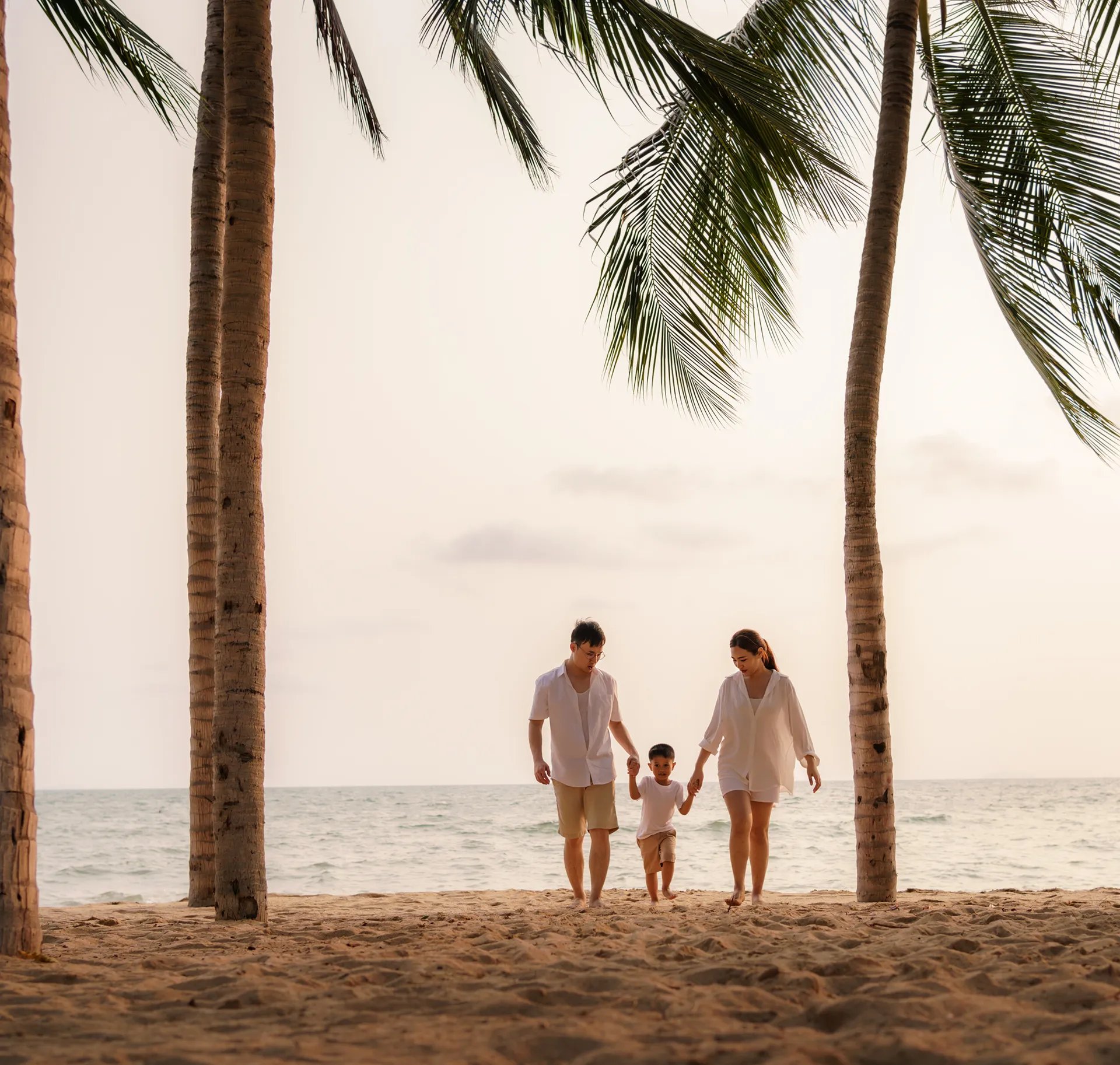 Family walking at Garza Blanca Puerto Vallarta Beach