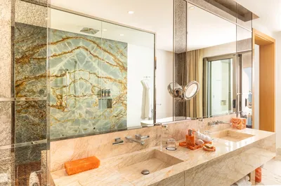Corner Suite at Garza Blanca Sanctuary with panoramic ocean views, floor-to-ceiling windows and a spacious terrace in Puerto Vallarta.