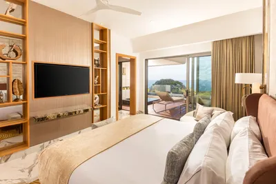 Junior Suite at Garza Blanca Sanctuary with a king bed, ocean views and a private terrace in Puerto Vallarta.