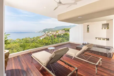 Corner Suite at Garza Blanca Sanctuary with panoramic ocean views, floor-to-ceiling windows and a spacious terrace in Puerto Vallarta.