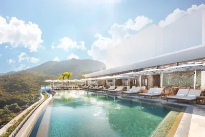 Rooftop at Garza Blanca Sanctuary with an infinity pool and panoramic views of Banderas Bay.