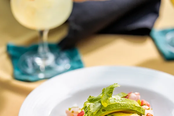 Sierra Lago Resort & Spa - Vertical view of a ceviche with avocado and a cocktail at La Capilla