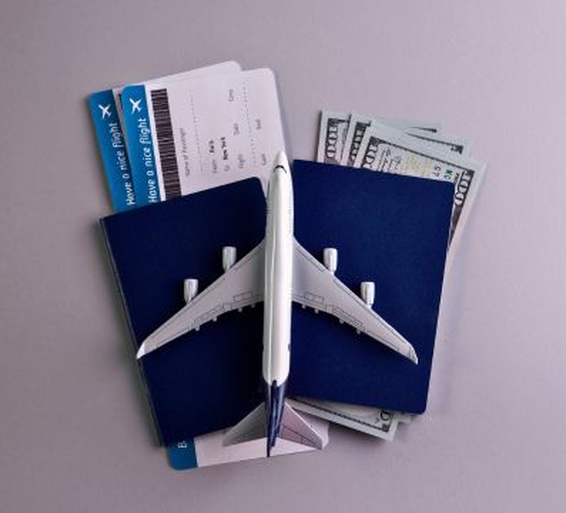 passport with flying tickets and money