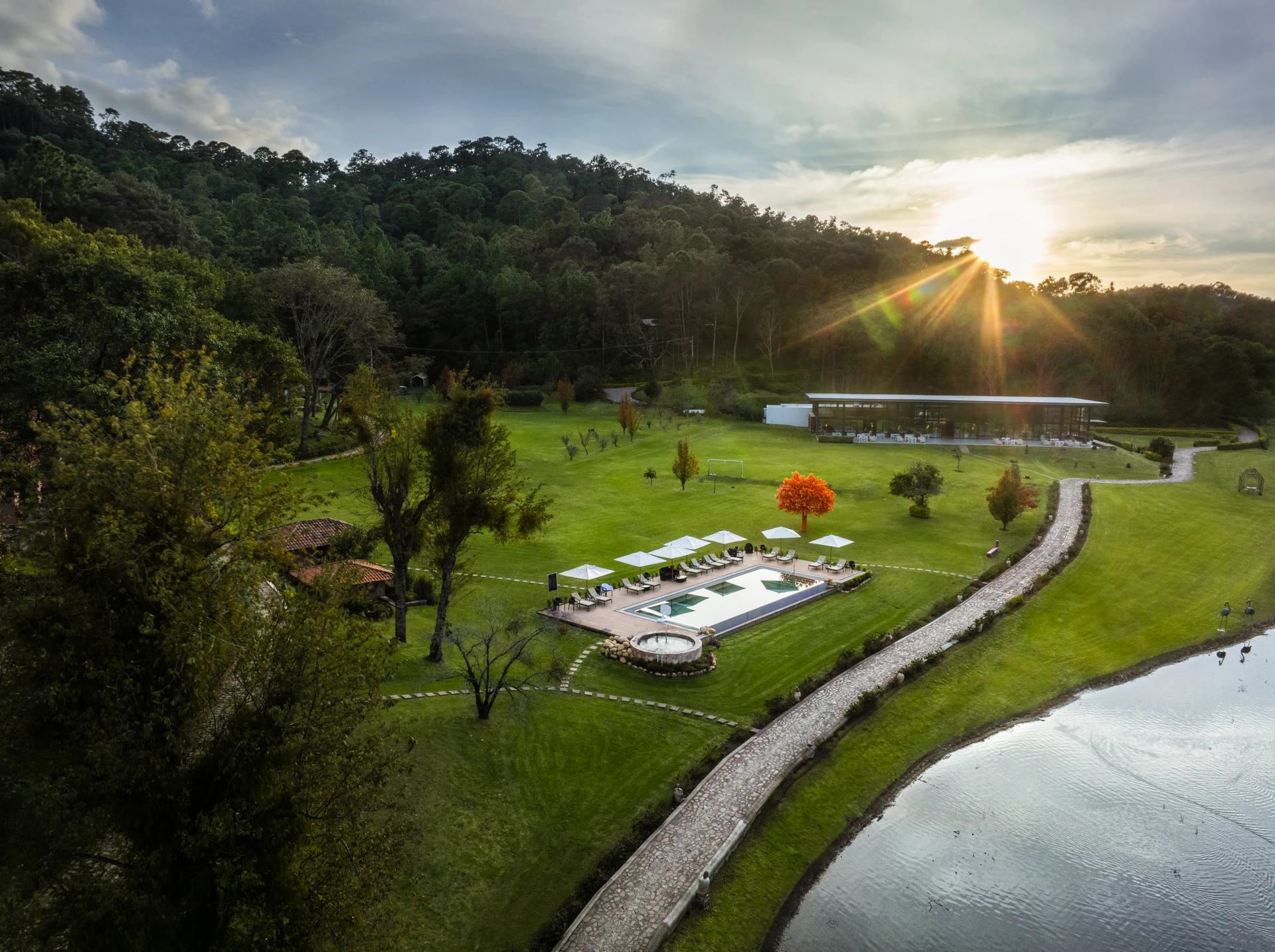 Sierra Lago Resort & Spa - Aerial view of the resort pool, gardens and lake at sunset