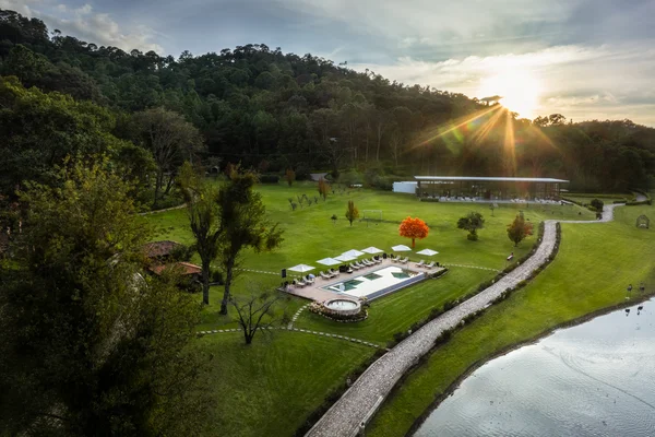 Sierra Lago Resort & Spa - Aerial view of the resort pool, gardens and lake at sunset