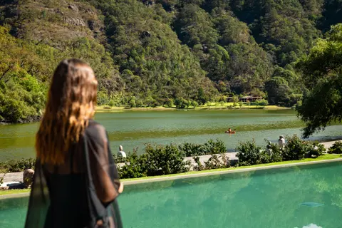 Sierra Lago Resort & Spa - Woman looking at the lake and mountains from the edge of the pool