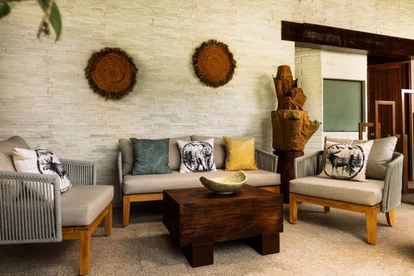 Sierra Lago Resort & Spa - Relaxation lounge with sofas, cushions and wooden table at the spa