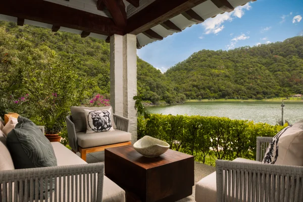 Sierra Lago Resort & Spa - Covered spa terrace with sofas overlooking the lake and mountains