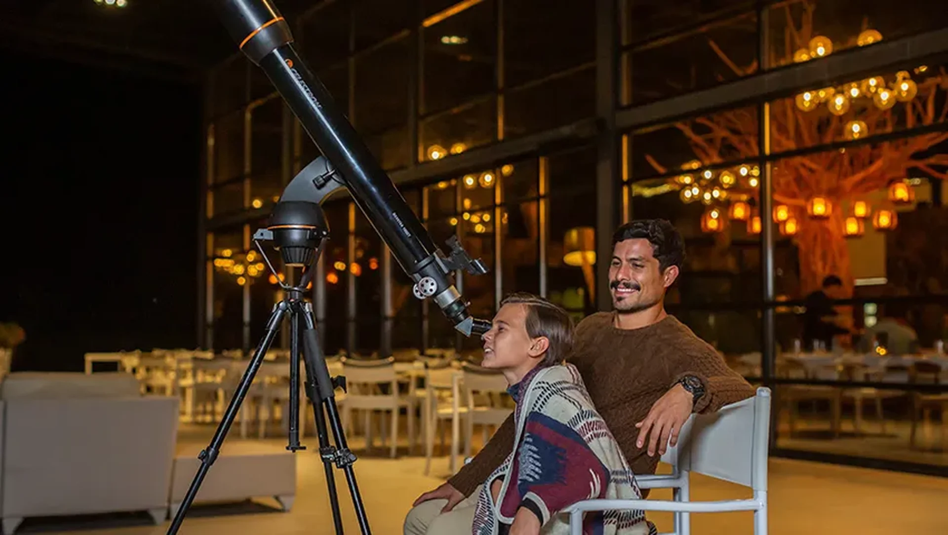Telescope under a starry sky