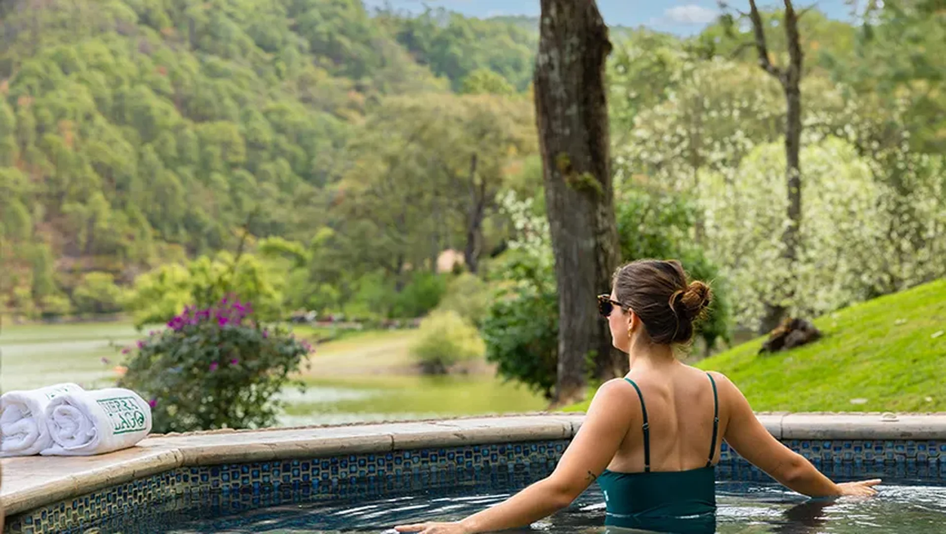 Woman relaxing in the outdoor jacuzzi