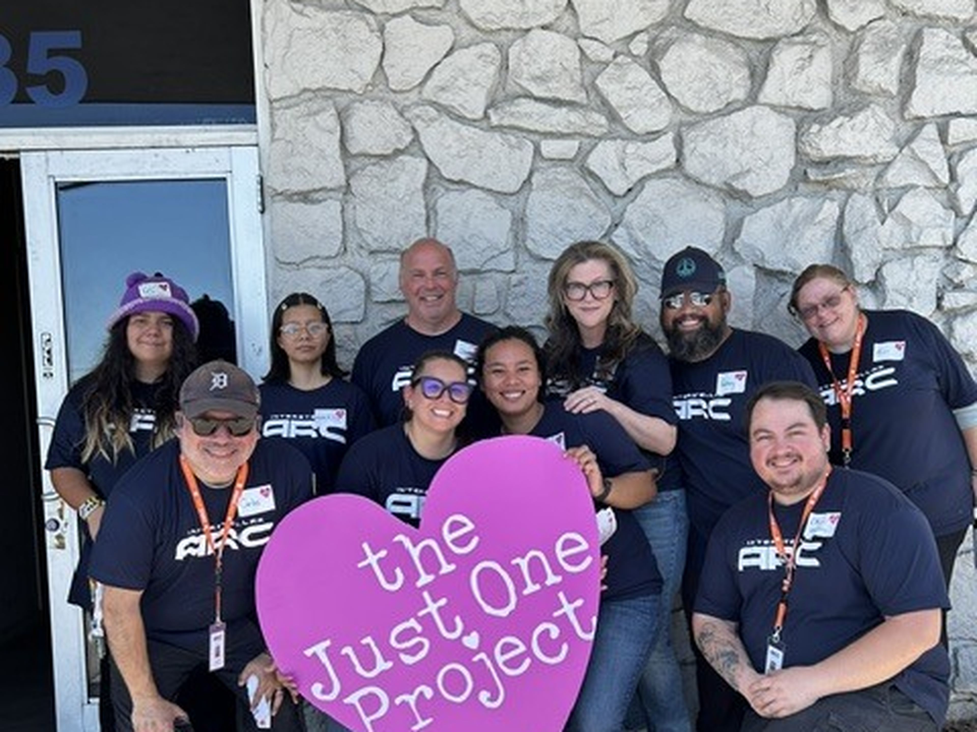 Arc team members volunteering with The Just One Project