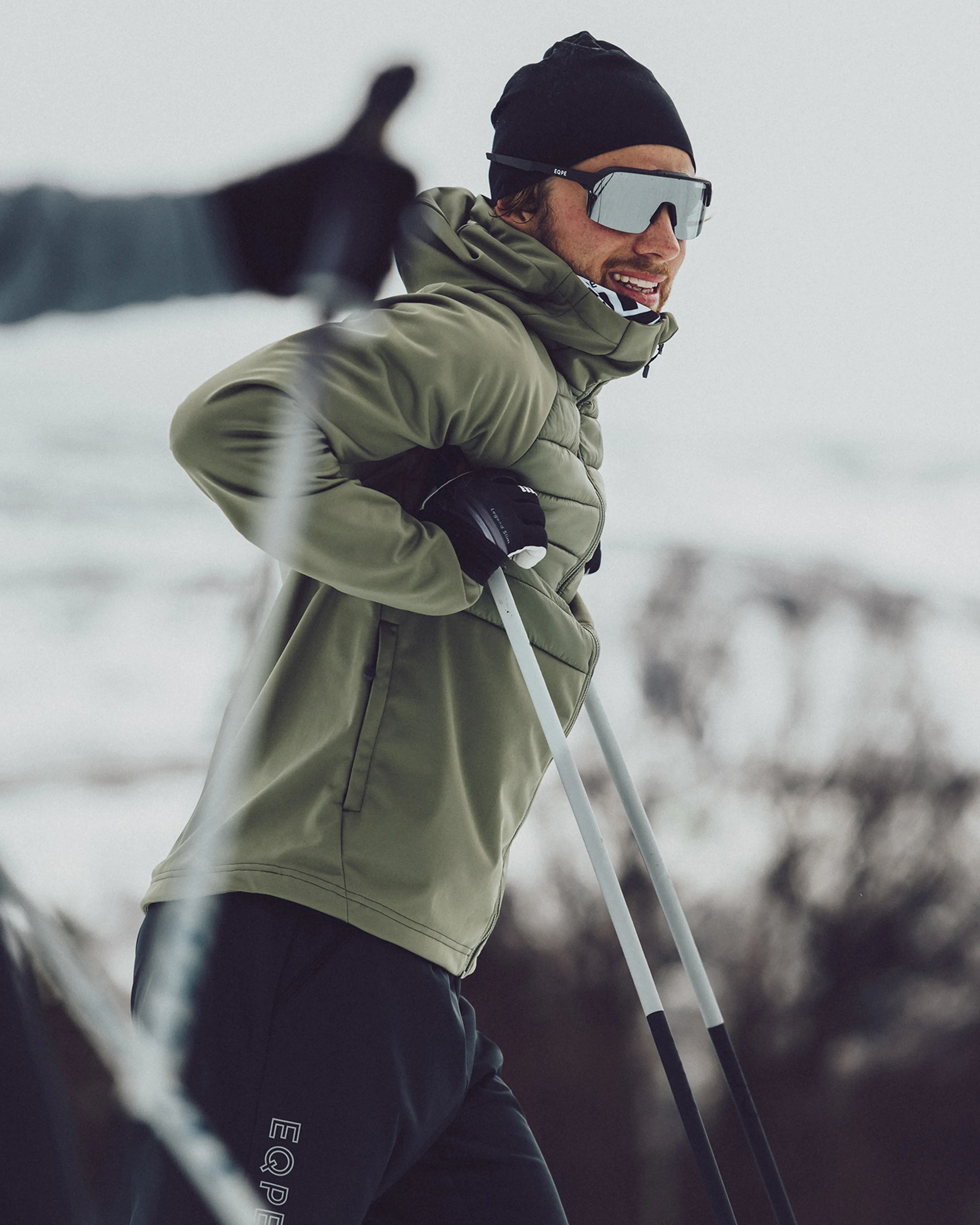 Person skiing in snowy landscape.