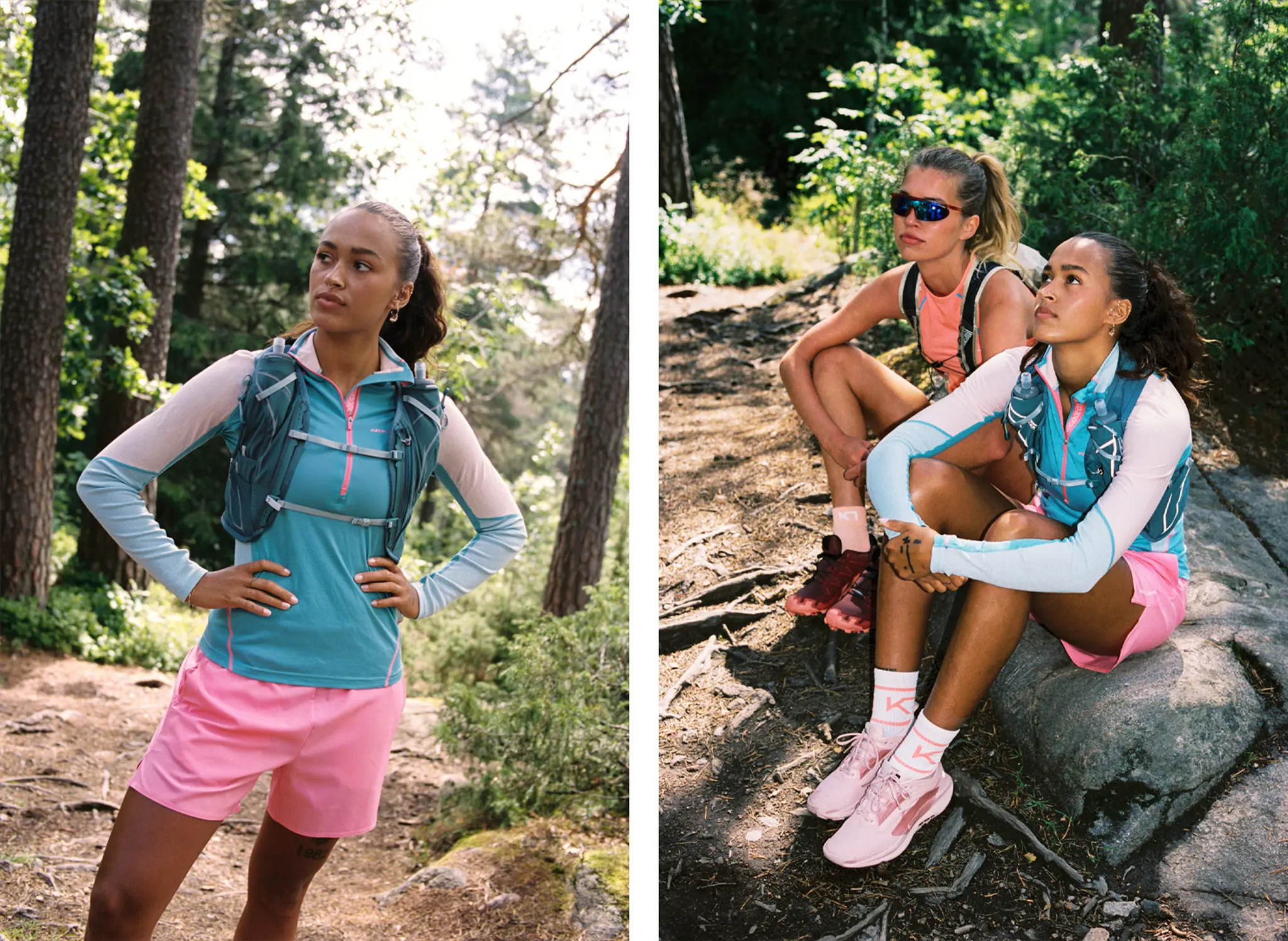 Two women in athletic gear pause during a forest run. One stands confidently, the other crouches beside her on a trail, both surrounded by trees.
