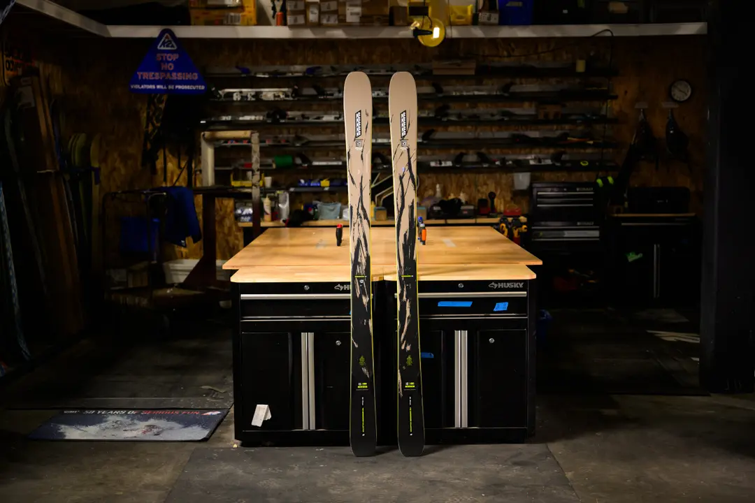 K2 skis standing in dark workshop