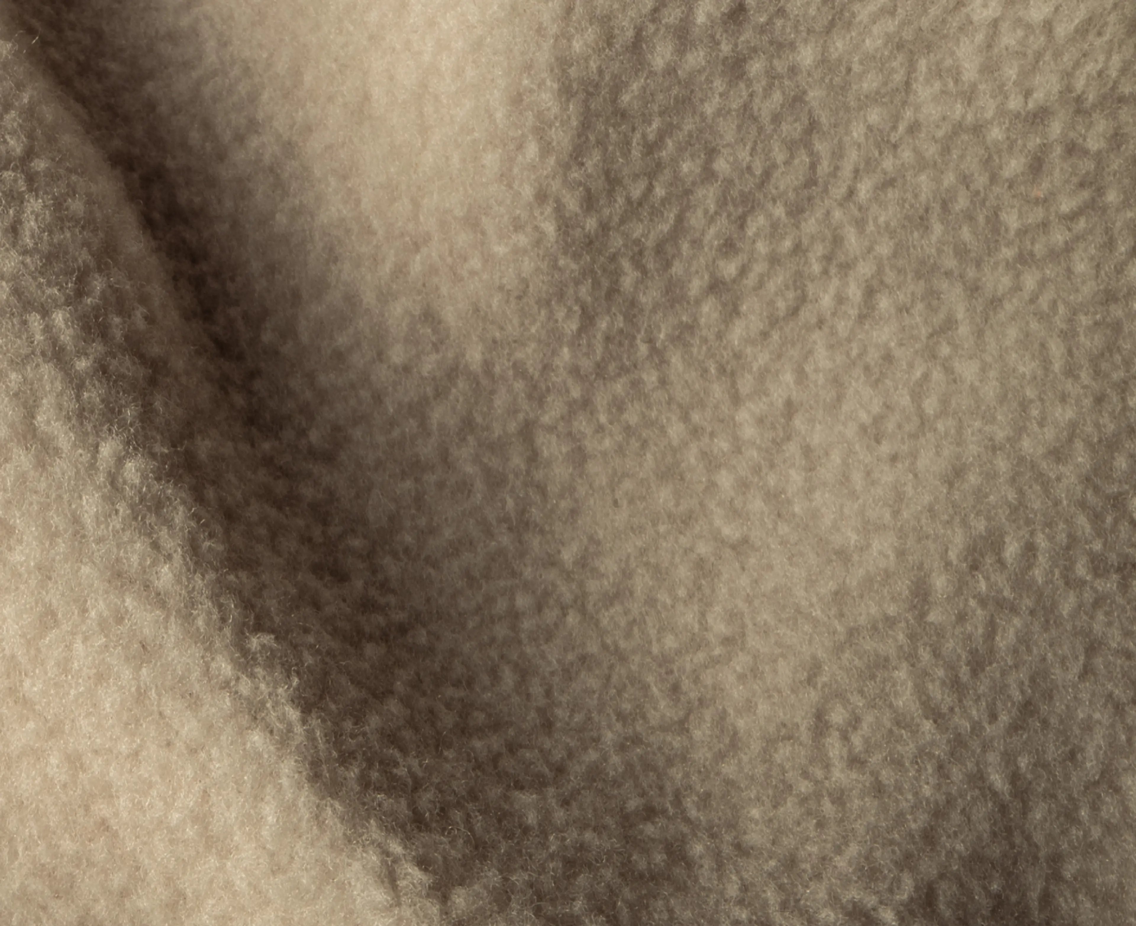 Close-up of soft, beige fleece fabric