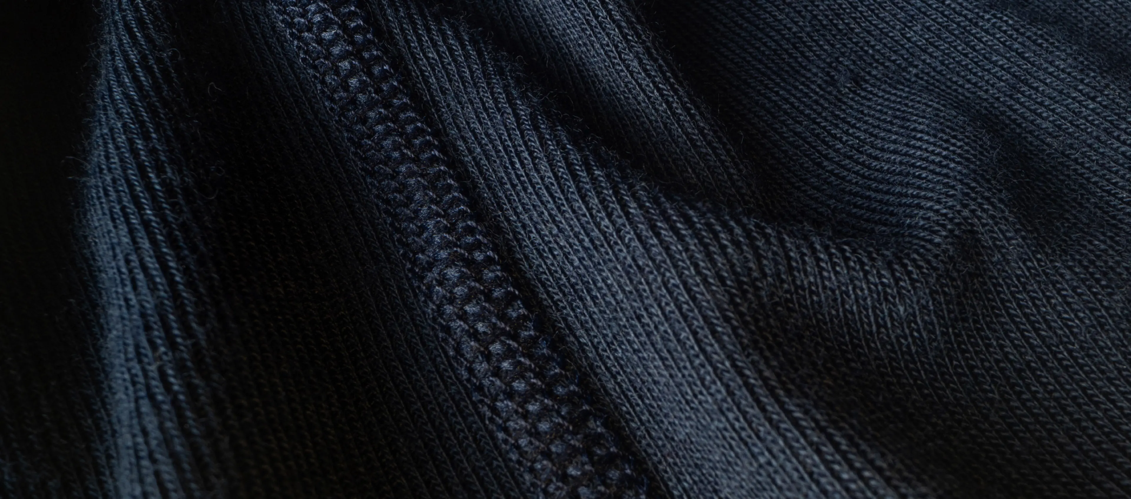 Close-up of a dark blue knitted fabric