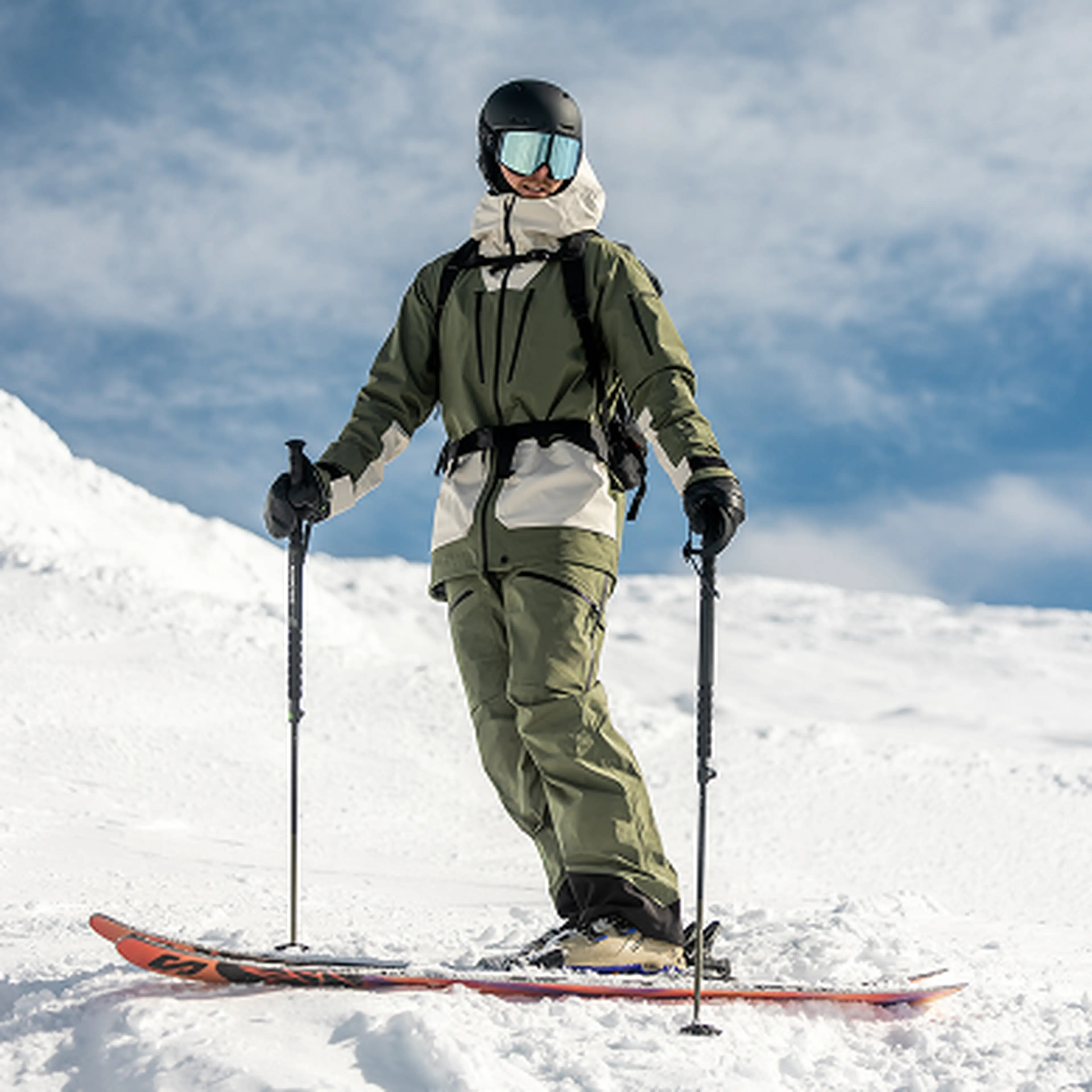 Skier standing on edge waiting to drop in