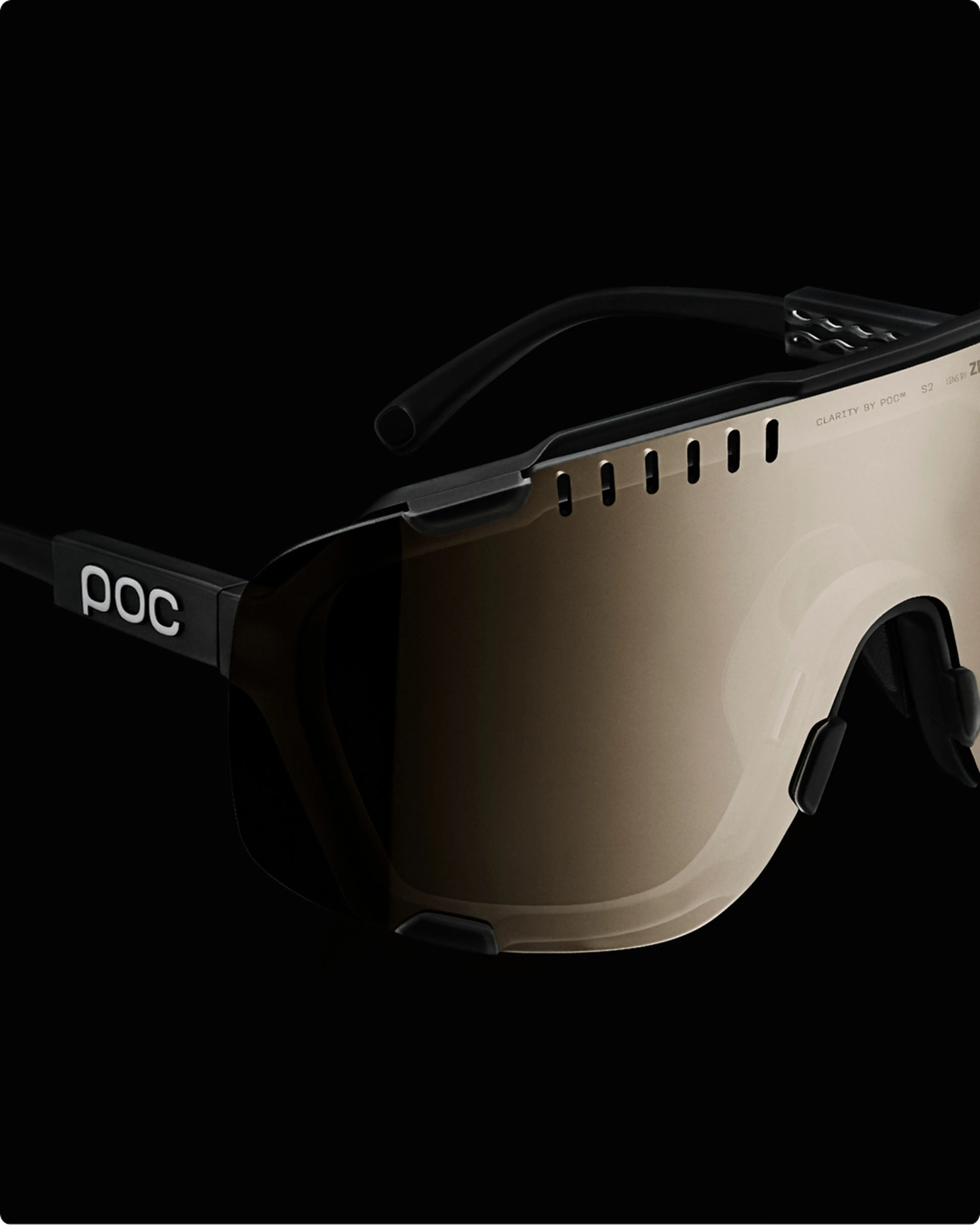 Futuristic sunglasses with dark tinted lenses, black frame, and ventilation slots, set against a black background.