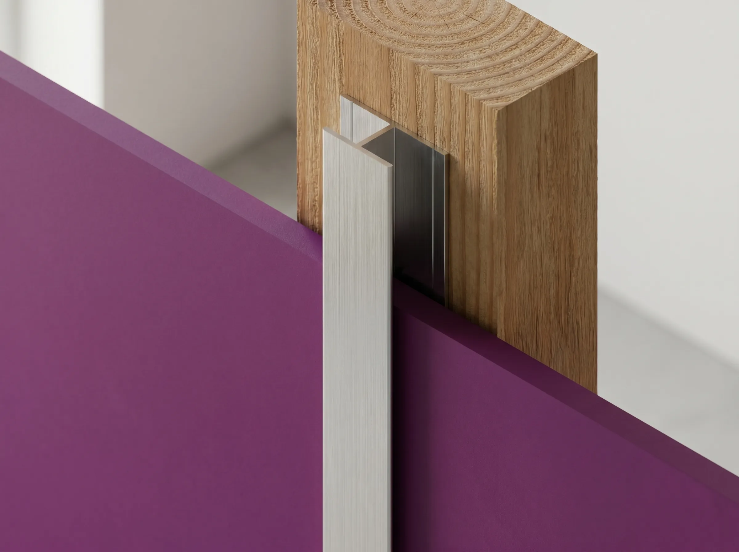 Close-up of a wooden block with a recessed metal piece holding a purple panel in place, against a neutral background.