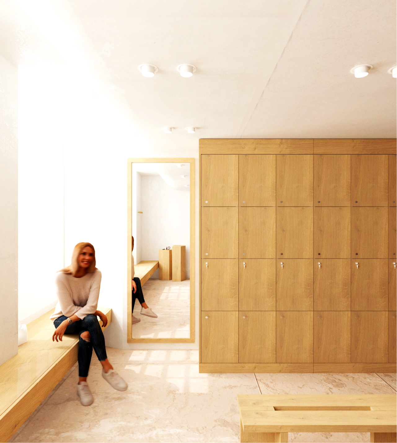 Caudalie Studio Woman sitting in a bright locker room with wooden lockers and a full-length mirror, wearing casual attire and sneakers.
