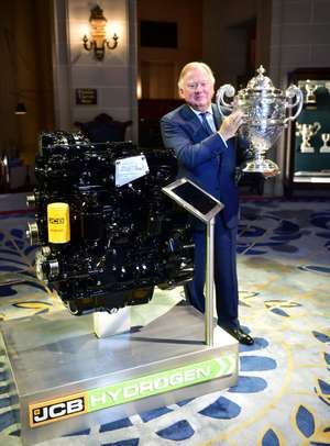 Lord Bamford Pictured With The Dewar Trophy