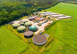 Aerial View Over Biogas Plant And Farm In Green Fields. Renewable Energy From Biomass. Modern Agriculture In Czech Republic And European Union.