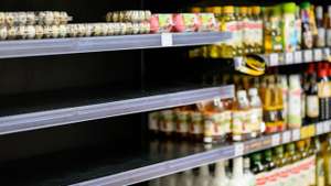Empty Egg Shelves In A Grocery Store Or Supermarket. Hoarding Food Due To Coronavirus Outbreak. Prepare Food Supplies For The Worst Case Of COVID 19 Pandemic. Stockpiling Crisis All Around The World.