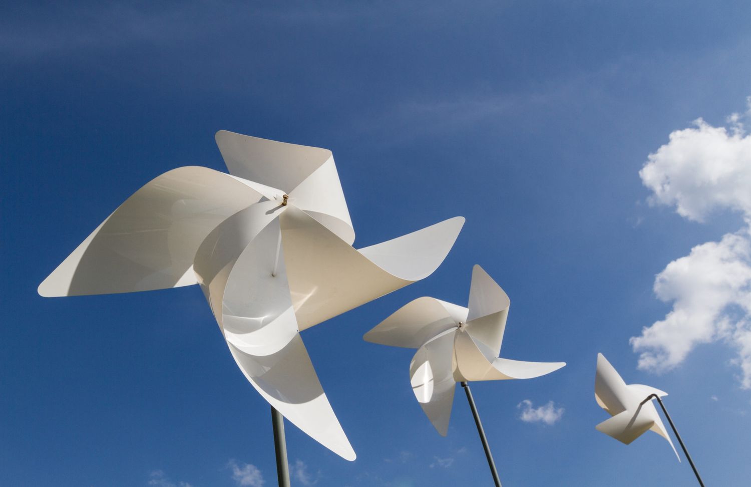 White Pinwheel And Windmill With Blue Sky And White Cloud Backgr