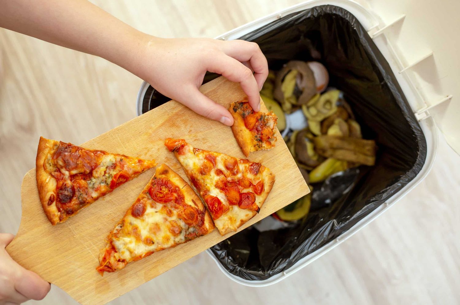 Woman Hands Throwing Food Into The Trash, Bin, Waste Of Food, Food Concept