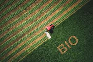 Bio Concept And Tactor Mowing Green Field