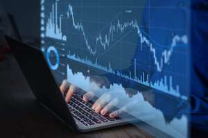 Trading On Stock Exchange Market And Investment Strategy For Financial Assets With Person Using Online Software To Analyze Price Statistics And Trade From Home At Night To Make Profit