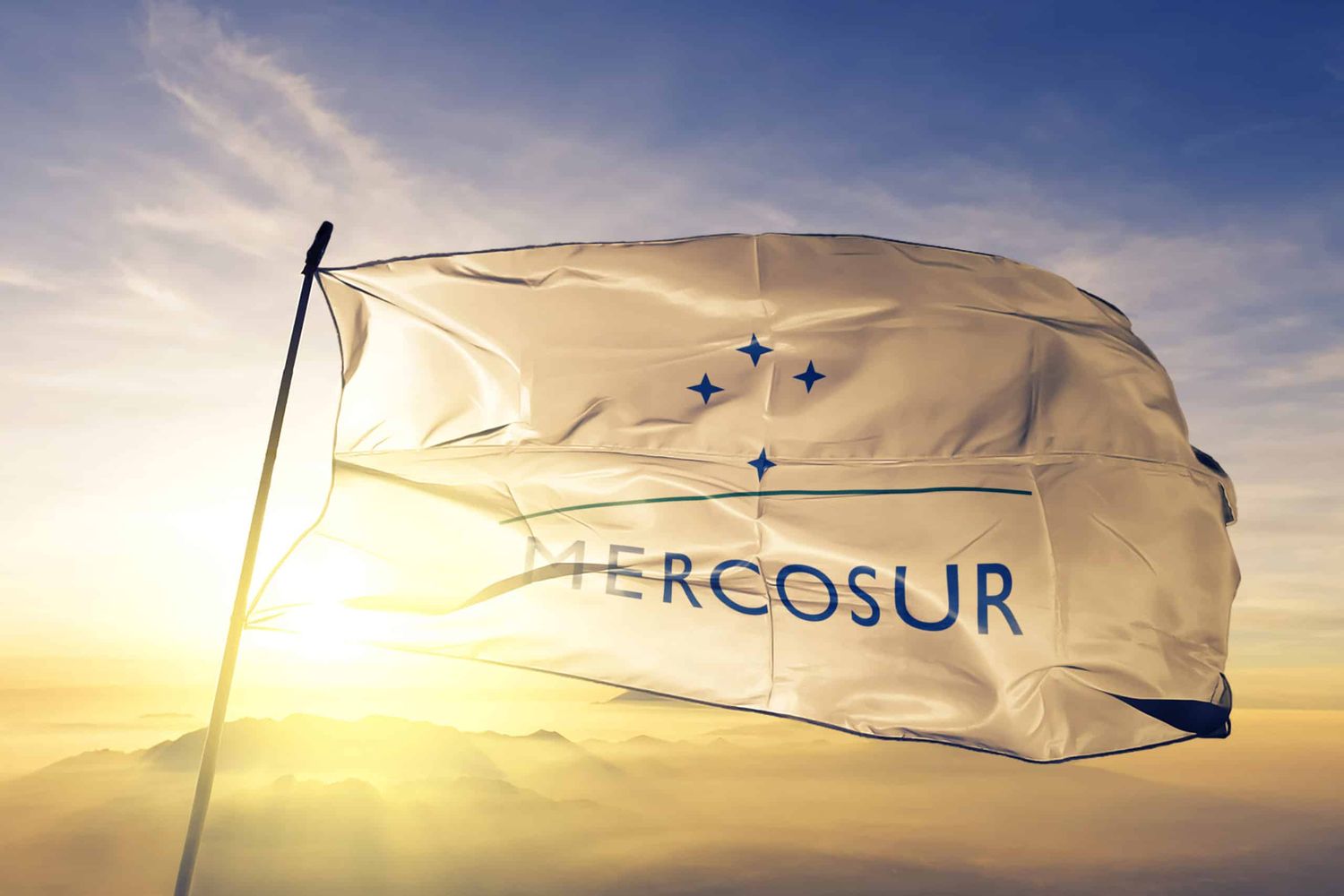 Mercosur Mercado Comun del Sur flag textile cloth fabric waving on the top sunrise mist fog